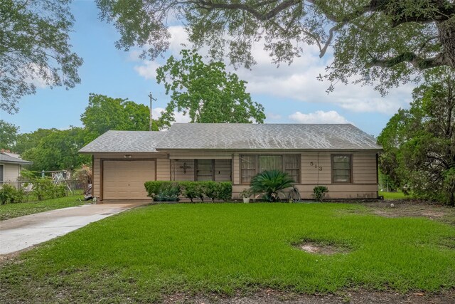 513 Frankie St, Wharton, TX 77488 - single story home featuring driveway, a garage, a front lawn, and a shingled roof