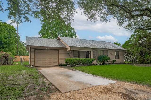 513 Frankie St, Wharton, TX 77488 - ranch-style home with driveway, a garage, and a shingled roof