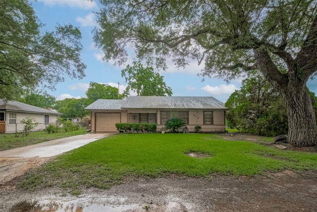 513 Frankie St, Wharton, TX 77488 - ranch-style house featuring driveway, a garage, and a front yard