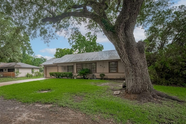513 Frankie St, Wharton, TX 77488 - single story home with driveway, an attached garage, a front lawn, and roof with shingles