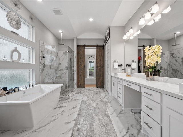 21310 Blue Wood Aster Ct, Cypress, TX 77433 - bathroom featuring a marble finish shower, a freestanding tub, vanity, marble tiled floors, and recessed lighting