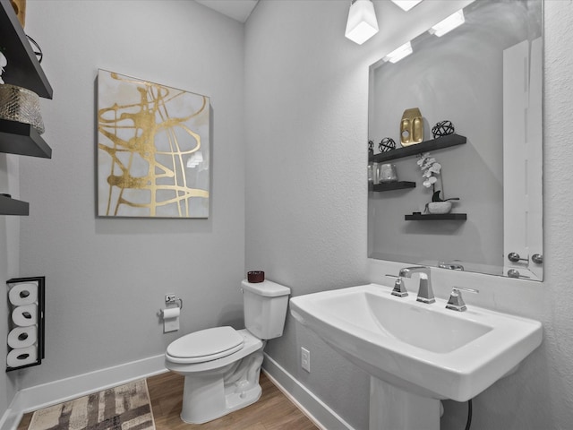 21310 Blue Wood Aster Ct, Cypress, TX 77433 - half bath with wood finished floors and toilet