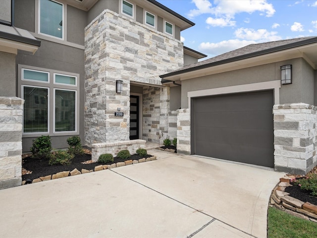 21310 Blue Wood Aster Ct, Cypress, TX 77433 - view of front facade featuring stone siding, stucco siding, concrete driveway, and a garage