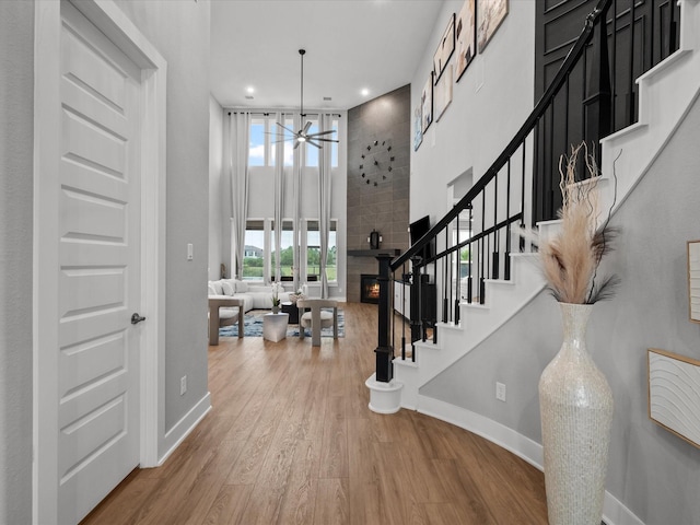 21310 Blue Wood Aster Ct, Cypress, TX 77433 - foyer entrance with recessed lighting, wood finished floors, stairway, a ceiling fan, and a towering ceiling