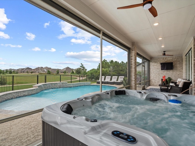 21310 Blue Wood Aster Ct, Cypress, TX 77433 - view of pool with ceiling fan, a hot tub, and a fenced backyard