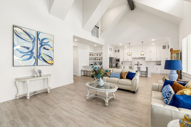 6523 Poplar Meadow Ln, Katy, TX 77493 - living room with beam ceiling, high vaulted ceiling, light wood-style floors, and recessed lighting