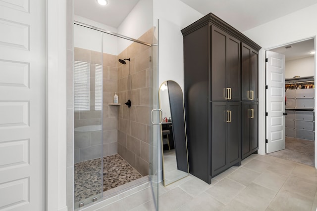 6523 Poplar Meadow Ln, Katy, TX 77493 - bathroom featuring a stall shower, tile patterned flooring, recessed lighting, and a walk in closet