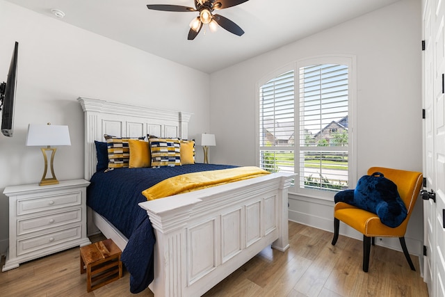 6523 Poplar Meadow Ln, Katy, TX 77493 - bedroom with light wood finished floors and ceiling fan