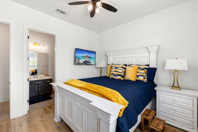 6523 Poplar Meadow Ln, Katy, TX 77493 - bedroom featuring light wood finished floors, ensuite bathroom, and ceiling fan