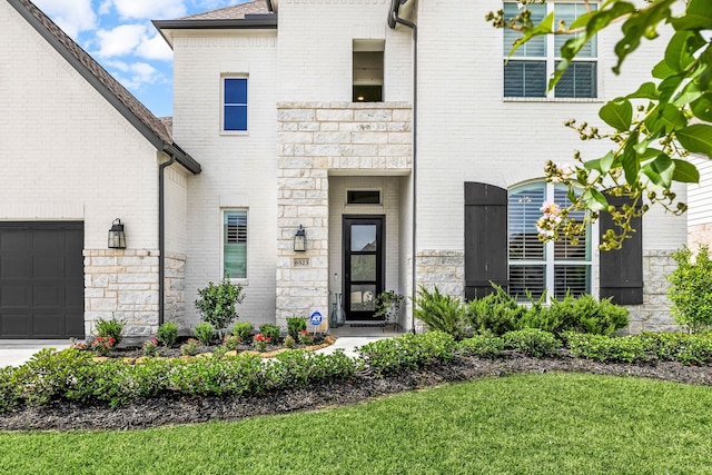 6523 Poplar Meadow Ln, Katy, TX 77493 - property entrance featuring brick siding, stone siding, and a shingled roof