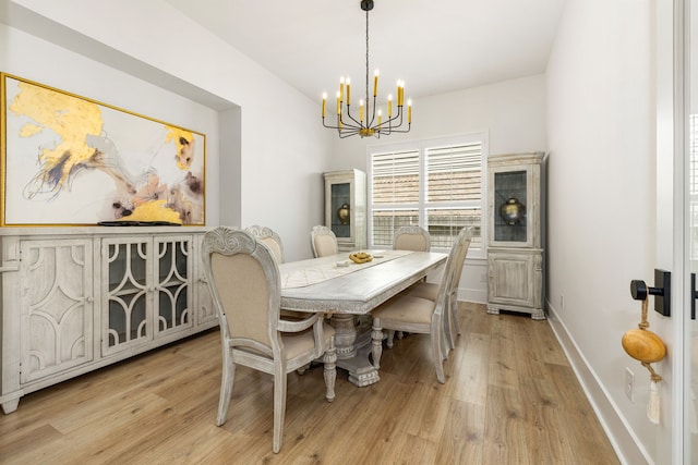 6523 Poplar Meadow Ln, Katy, TX 77493 - dining area with a chandelier and light wood-style flooring