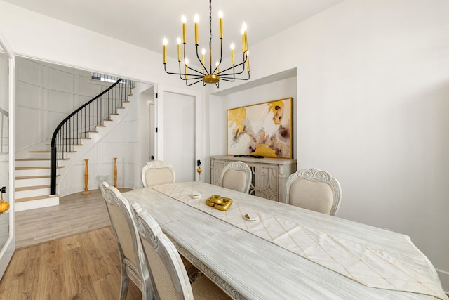 6523 Poplar Meadow Ln, Katy, TX 77493 - dining space with stairs, a chandelier, and light wood-type flooring