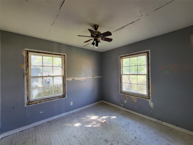 506 S Iowa St, La Porte, TX 77571 - spare room with ceiling fan and hardwood / wood-style flooring