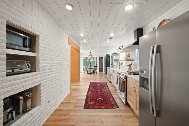 15722 Falmouth Dr, Houston, TX 77059 - kitchen featuring stainless steel appliances, wall chimney range hood, open shelves, recessed lighting, and light countertops