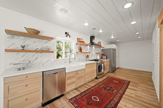 15722 Falmouth Dr, Houston, TX 77059 - kitchen with stainless steel appliances, open shelves, light brown cabinetry, wall chimney range hood, and light wood-style flooring