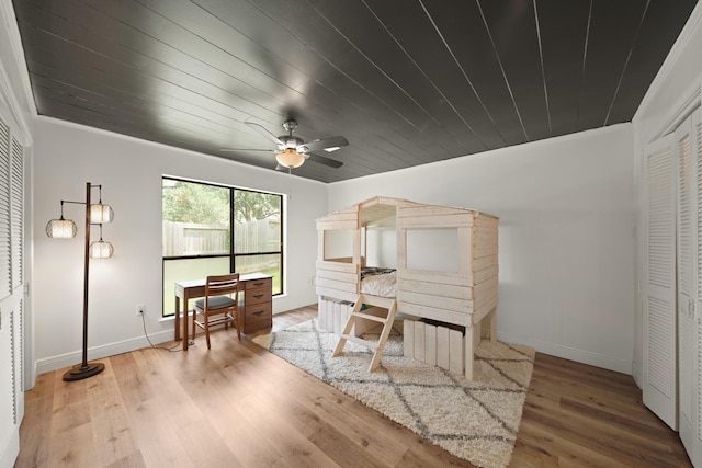15722 Falmouth Dr, Houston, TX 77059 - sitting room with wood finished floors, a ceiling fan, wooden ceiling, and crown molding