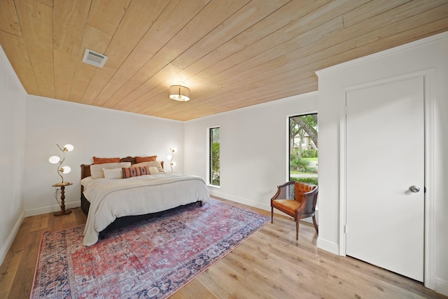 15722 Falmouth Dr, Houston, TX 77059 - bedroom featuring crown molding, wood finished floors, and wooden ceiling