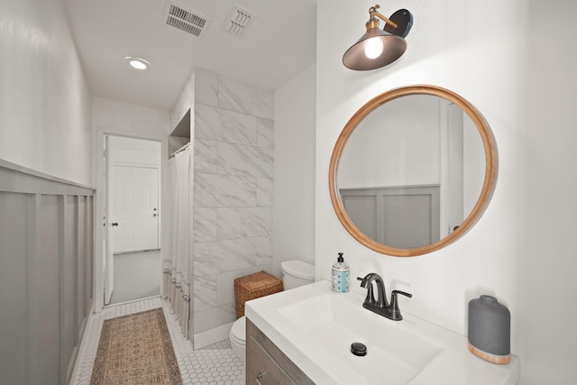 15722 Falmouth Dr, Houston, TX 77059 - bathroom featuring vanity, a shower with curtain, tile patterned flooring, recessed lighting, and a wainscoted wall