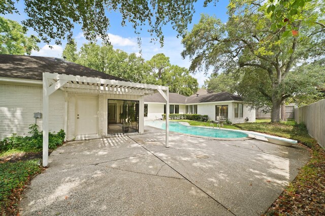 15722 Falmouth Dr, Houston, TX 77059 - back of property featuring a pergola, a patio area, a fenced backyard, and roof with shingles