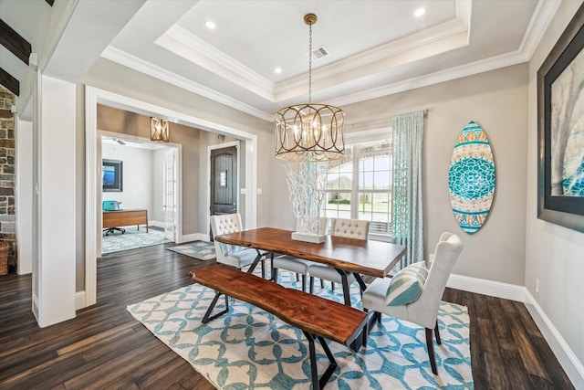 32319 Tall Oaks Way, Magnolia, TX 77354 - dining space featuring dark wood-style floors, a chandelier, crown molding, a raised ceiling, and recessed lighting