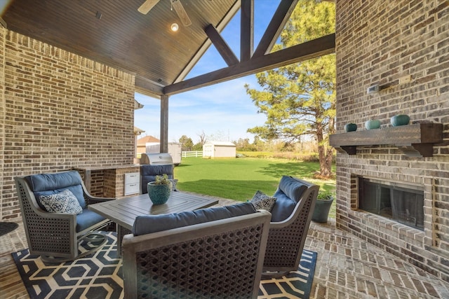 32319 Tall Oaks Way, Magnolia, TX 77354 - view of patio with an outdoor brick fireplace, a grill, and a ceiling fan