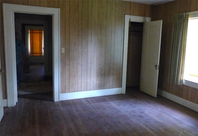 408 N Meyer St, Sealy, TX 77474 - empty room with wood walls and healthy amount of natural light