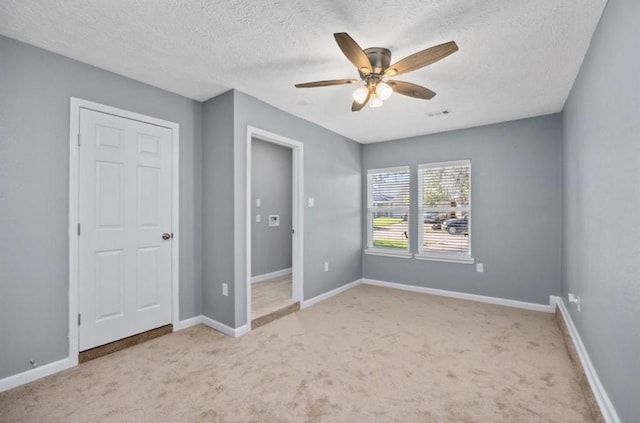 5622 Lycomb Dr, Houston, TX 77053 - unfurnished bedroom with carpet, a textured ceiling, and a ceiling fan
