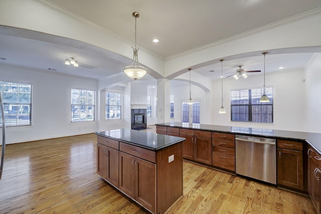 7539 Highmeadow, Houston, TX 77063 - kitchen featuring stainless steel dishwasher, open floor plan, arched walkways, a ceiling fan, and light wood-style floors