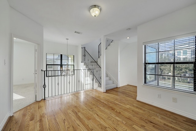 7539 Highmeadow, Houston, TX 77063 - spare room featuring a chandelier and light wood finished floors