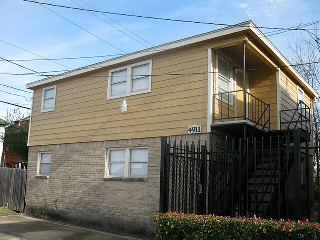 4911 Delano St, Houston, TX 77004 - view of home's exterior featuring brick siding