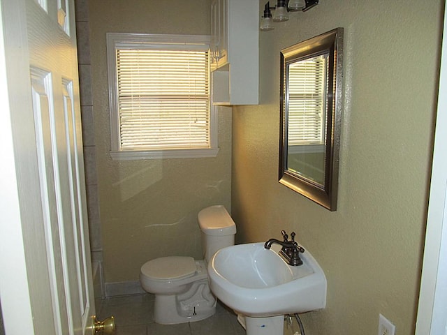 4911 Delano St, Houston, TX 77004 - bathroom with tile patterned floors and toilet