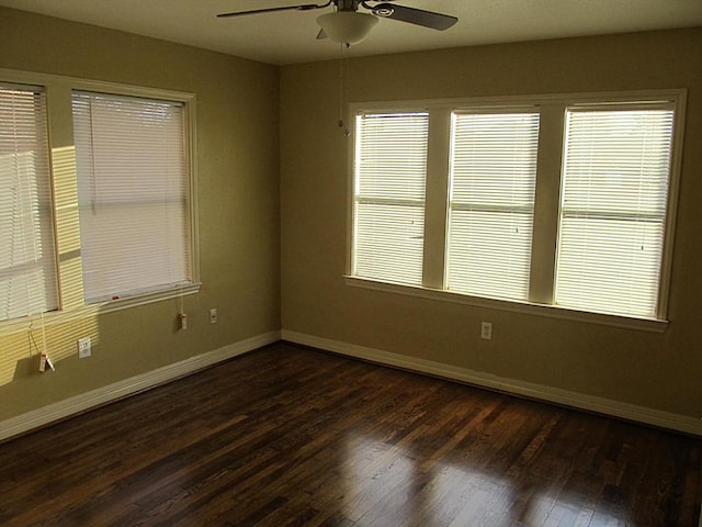 4911 Delano St, Houston, TX 77004 - spare room featuring a ceiling fan, dark wood finished floors, and healthy amount of natural light