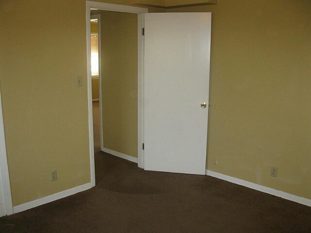 4911 Delano St, Houston, TX 77004 - unfurnished bedroom with baseboards and carpet