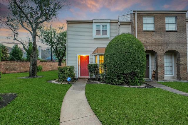 2002 Gentryside Dr Unit 117, Houston, TX 77077 - townhome / multi-family property with a front yard and brick siding