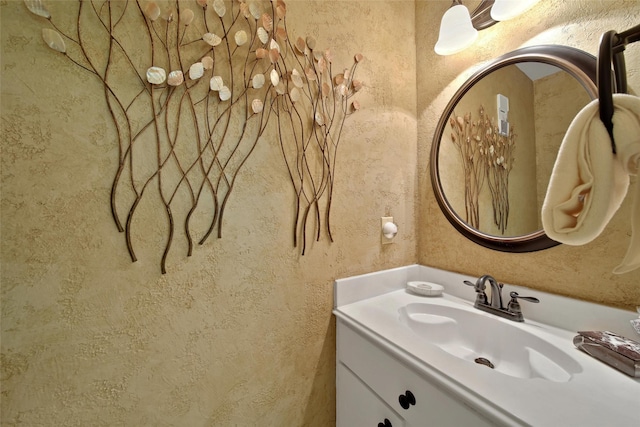 2002 Gentryside Dr Unit 117, Houston, TX 77077 - bathroom with vanity and a textured wall