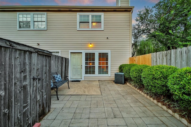 2002 Gentryside Dr Unit 117, Houston, TX 77077 - rear view of house with a patio, a fenced backyard, and a chimney