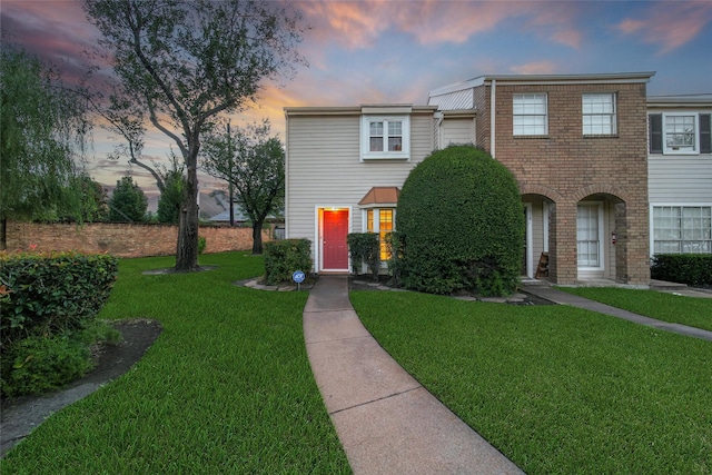 2002 Gentryside Dr Unit 117, Houston, TX 77077 - townhome / multi-family property with a front yard and brick siding