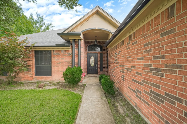 3803 Doveswood Cir, Needville, TX 77461 - doorway to property featuring a shingled roof and brick siding