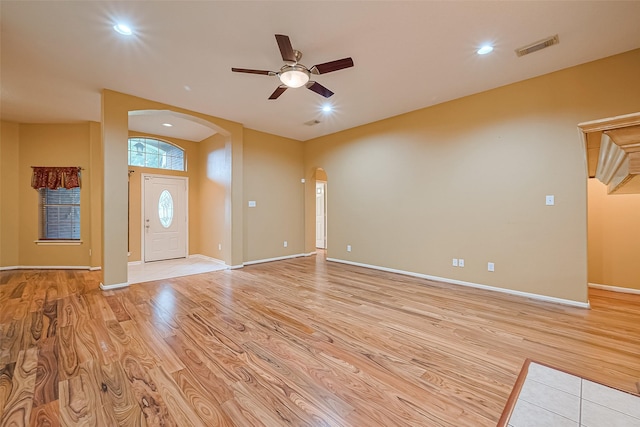 3803 Doveswood Cir, Needville, TX 77461 - foyer entrance with arched walkways, ceiling fan, light wood-style flooring, and recessed lighting