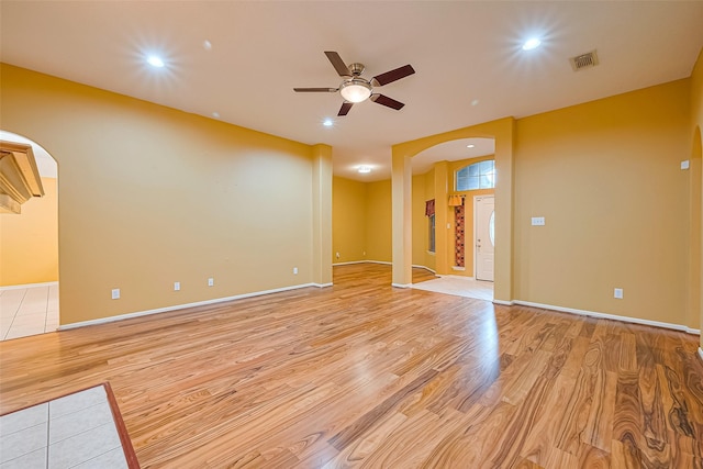 3803 Doveswood Cir, Needville, TX 77461 - unfurnished room with arched walkways, light wood-type flooring, a ceiling fan, and recessed lighting