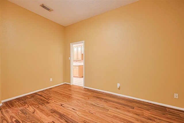 3803 Doveswood Cir, Needville, TX 77461 - spare room featuring light wood-style floors and baseboards