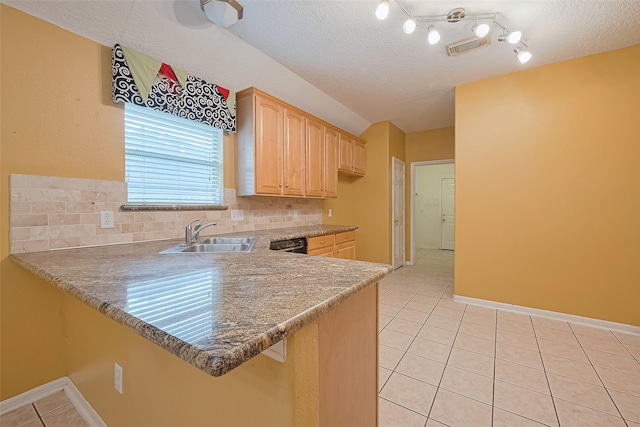 3803 Doveswood Cir, Needville, TX 77461 - kitchen with light brown cabinets, light tile patterned flooring, backsplash, a peninsula, and a textured ceiling