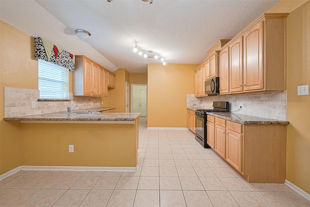 3803 Doveswood Cir, Needville, TX 77461 - kitchen featuring black gas range, light tile patterned floors, light brown cabinets, a peninsula, and a textured ceiling
