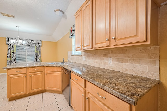 3803 Doveswood Cir, Needville, TX 77461 - kitchen with vaulted ceiling, a peninsula, a chandelier, light tile patterned floors, and backsplash