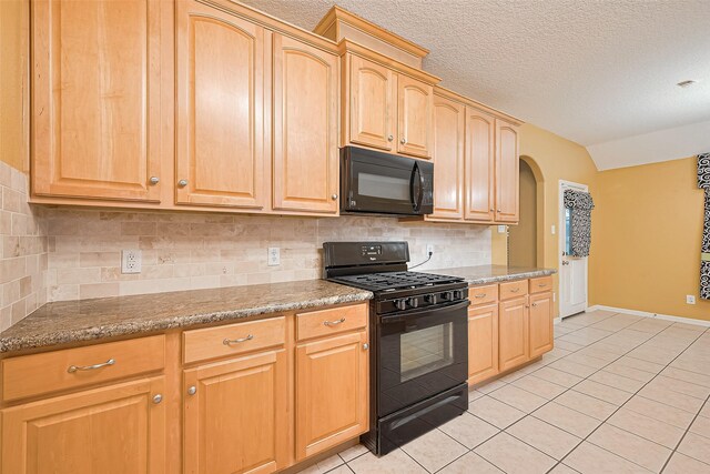 3803 Doveswood Cir, Needville, TX 77461 - kitchen featuring black appliances, light tile patterned flooring, arched walkways, backsplash, and light brown cabinetry
