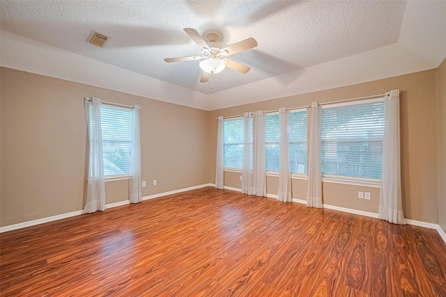 3803 Doveswood Cir, Needville, TX 77461 - unfurnished room featuring light wood finished floors, a ceiling fan, and a textured ceiling