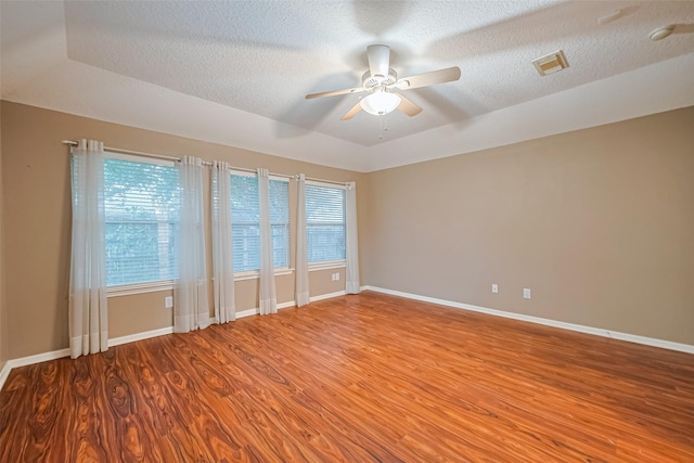 3803 Doveswood Cir, Needville, TX 77461 - unfurnished room featuring wood finished floors, a ceiling fan, a smoke detector, and a textured ceiling