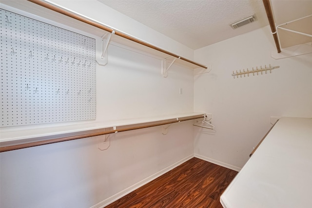 3803 Doveswood Cir, Needville, TX 77461 - walk in closet with dark wood-type flooring