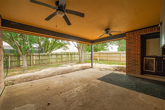 3803 Doveswood Cir, Needville, TX 77461 - fenced backyard featuring a ceiling fan and a patio area