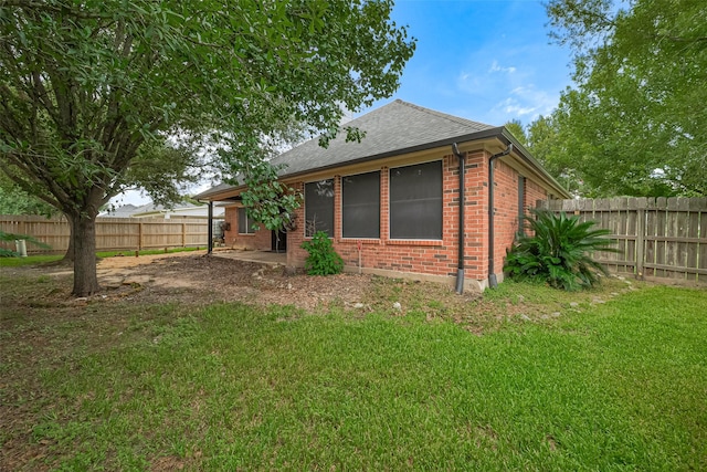 3803 Doveswood Cir, Needville, TX 77461 - back of house with a fenced backyard, a shingled roof, brick siding, and a patio